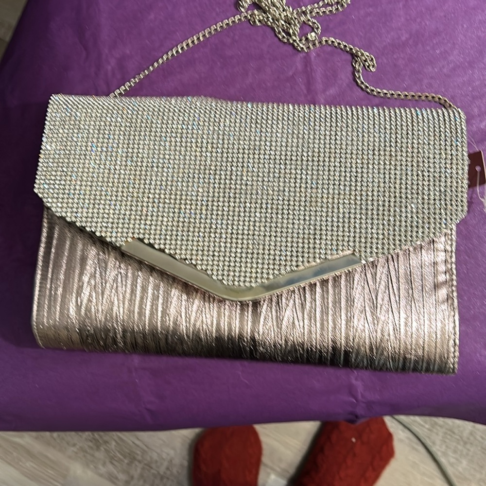 Mauve and Rhinestones clutch bag with chain shoulder attachment.